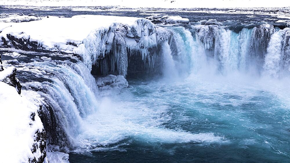 Godafoss waterfall, icy and snowy rock face, Northern Iceland Eyestra, Iceland, Europe