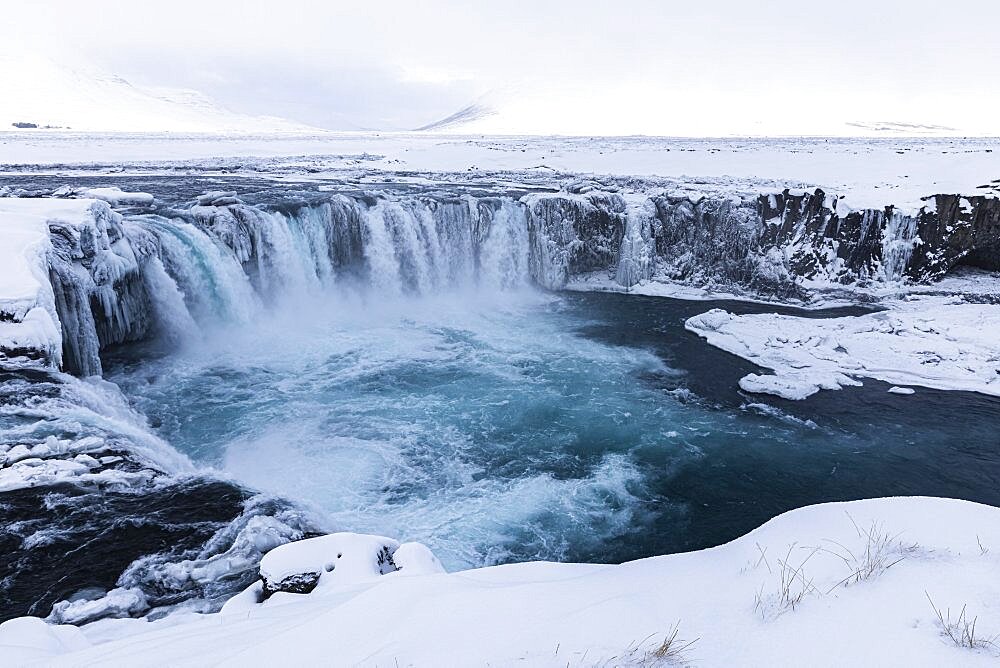 Godafoss waterfall, icy and snowy rock face, snowy landscape, Northern Iceland Eyestra, Iceland, Europe