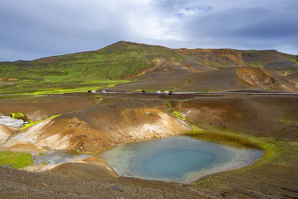 Volcanic landscape with colourful hills, pipes of the Krafla geothermal power plant, geothermal area, Northern Iceland, Iceland, Europe