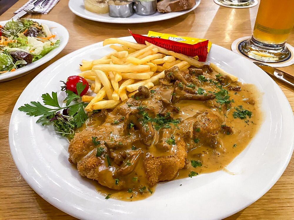 Creamed schnitzel with chanterelles, French fries, ketchup, mayonnaise, parsley, Hesse, Germany, Europe