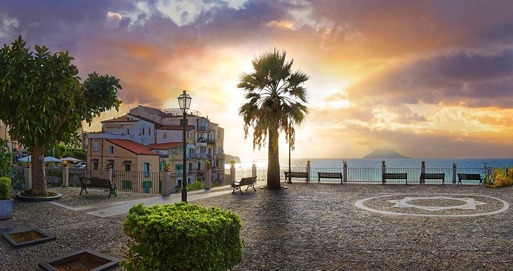 Belvedere Piazza del Cannone town square at sunset and Stromboli volcano in the sea in the distance, Tropea, Vibo Valentia, Calabria, Southern Italy, Italy, Europe