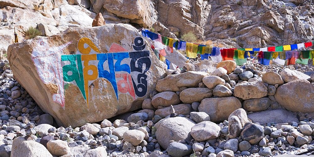 Mani stones with the engraved Tibetan mantra Om Mani Padme Hum, Nubra Valley, Ladakh, Jammu and Kashmir, India, Asia