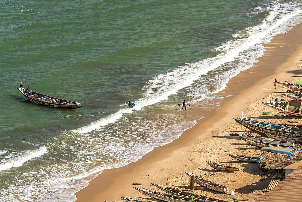 Fishing boats on the beach from the fish market in Bakau, Gambia, West Africa, Africa