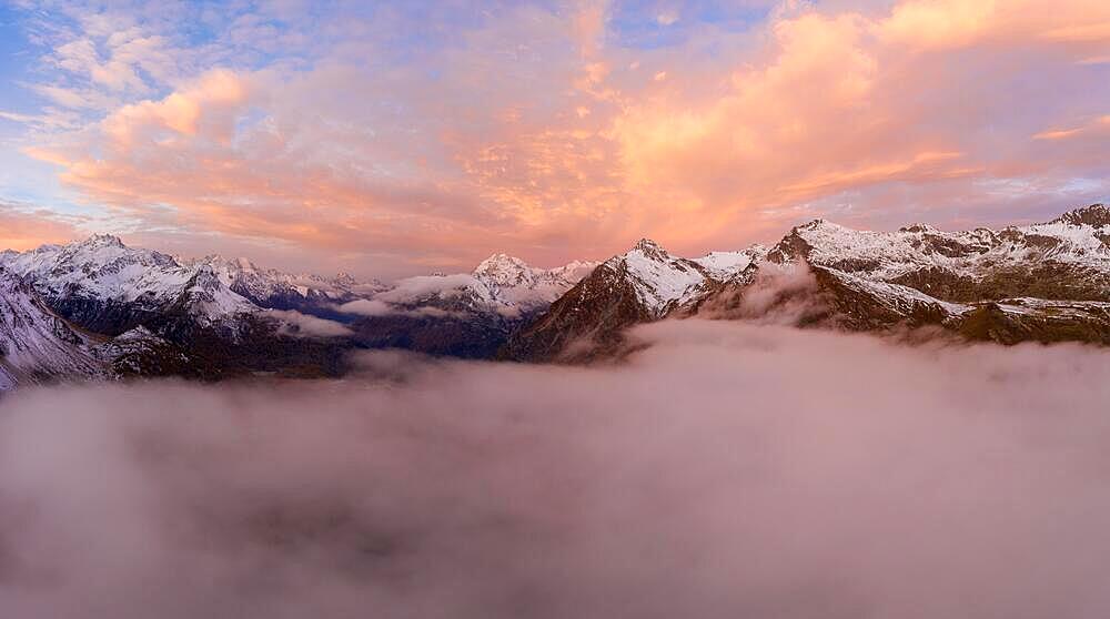 Aerial view over the sea of fog in front of sunrise over the Maloja Pass in autumn, Canton Grisons, Switzerland, Europe