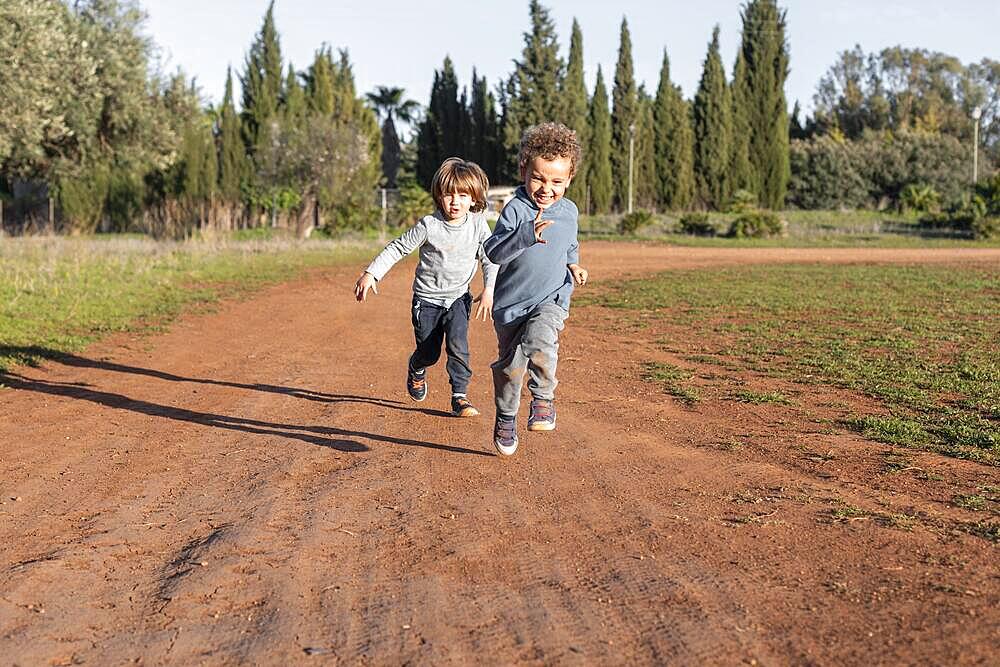 little boys outdoors running