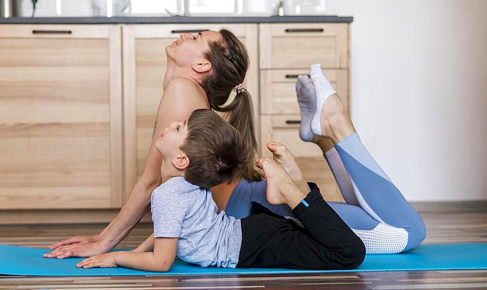 Fit mother training with her son