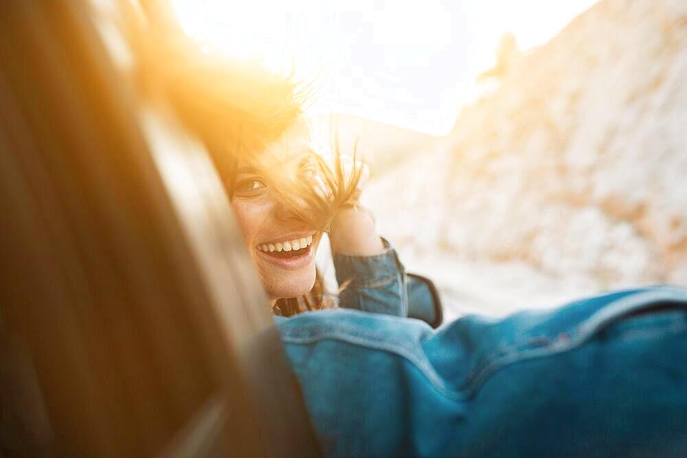 Woman smiling while being car ride