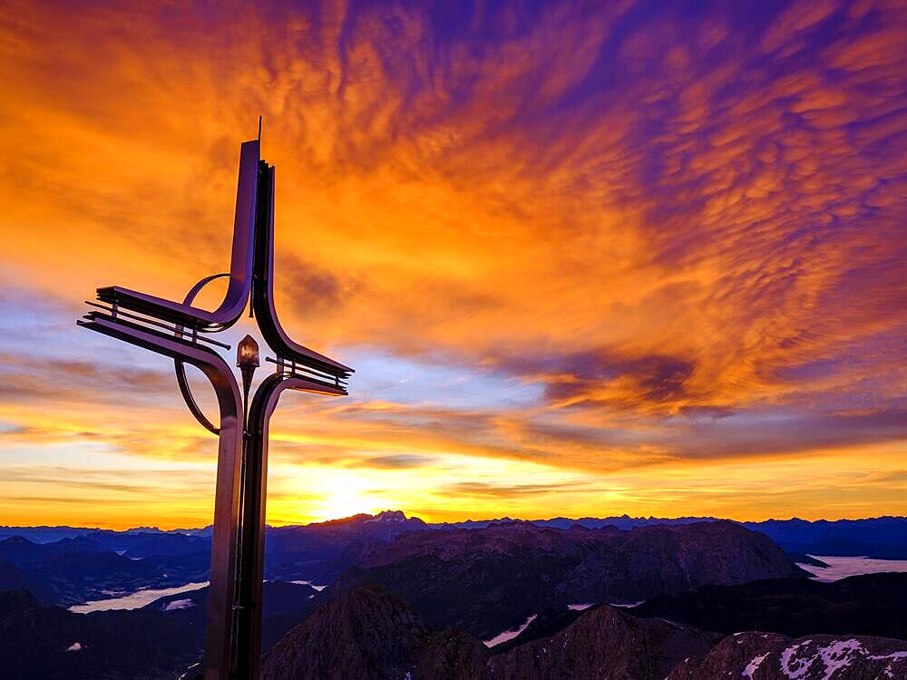 Colourful clouds at dawn, summit cross Hoher Goell, Berchtesgaden Alps, Berchtesgaden National Park, Schoenau am Koenigssee, Berchtesgadener Land, Upper Bavaria, Bavaria, Germany, Europe