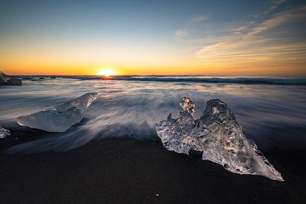 Diamond Beach, icebergs on black lava beach, at Joekulsarlon glacier lagoon, sunrise, Vatnajoekull National Park, Hornafjoerour, South Iceland, Iceland, Europe