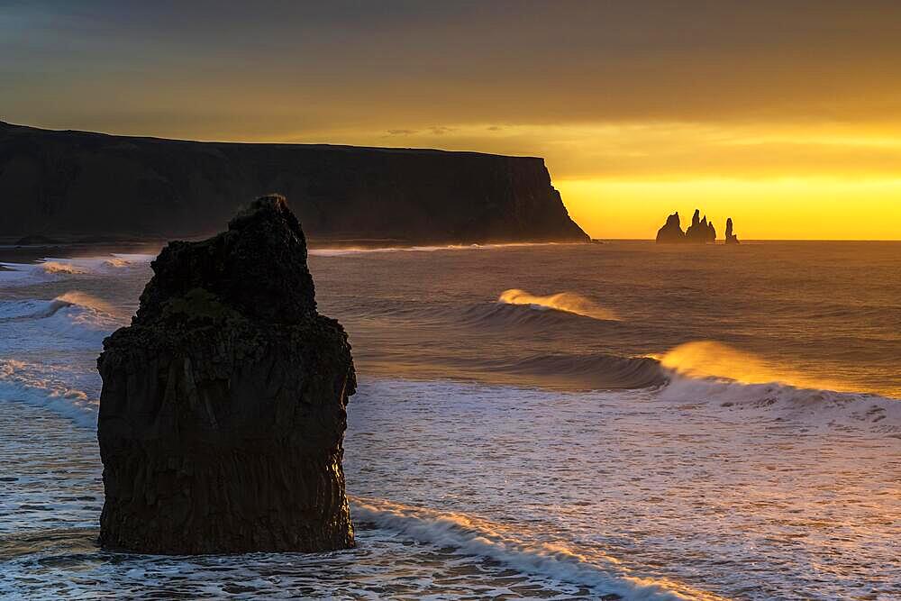 View from Cape Dyrholaey at sunrise, rock formations Reynisdrangar and Mount Reynisfjall, Vik i Myrdal, Suourland, Iceland, Europe