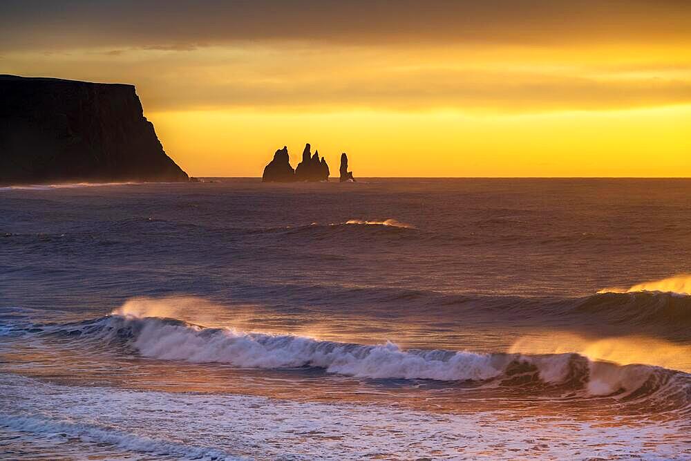 View from Cape Dyrholaey at sunrise, rock formations Reynisdrangar and Mount Reynisfjall, Vik i Myrdal, Suourland, Iceland, Europe