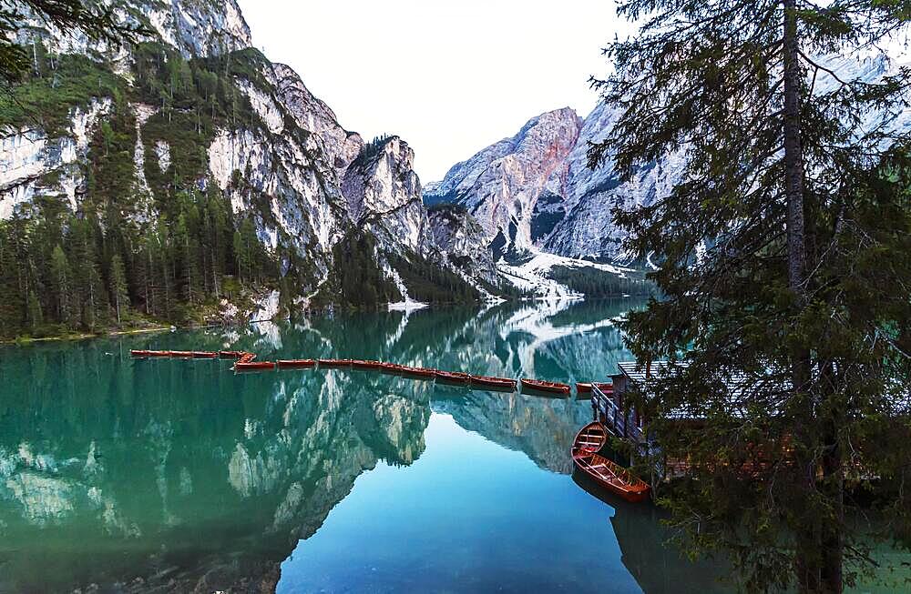 Wooden boats in a row on Lake Lake Prags in the South Tyrolean municipality of Lake Prags, Italy, Europe