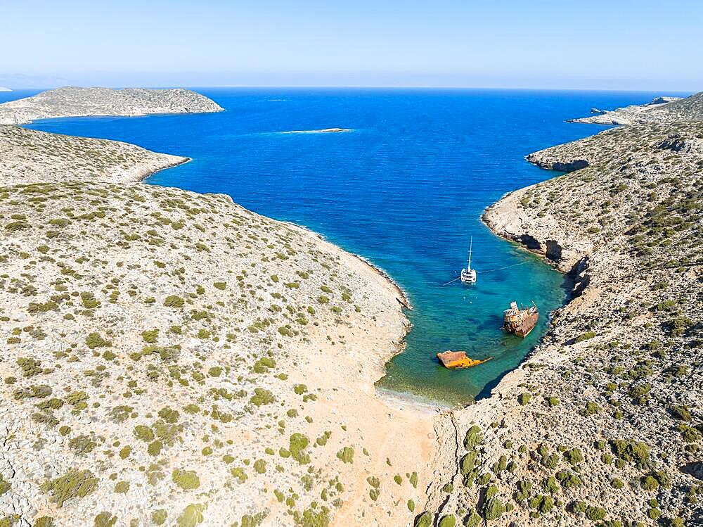 Aerial view, sailing catamaran in a bay, shipwreck Olympia, Amorgos, Cyclades Island, Aegean Sea, Greece, Europe