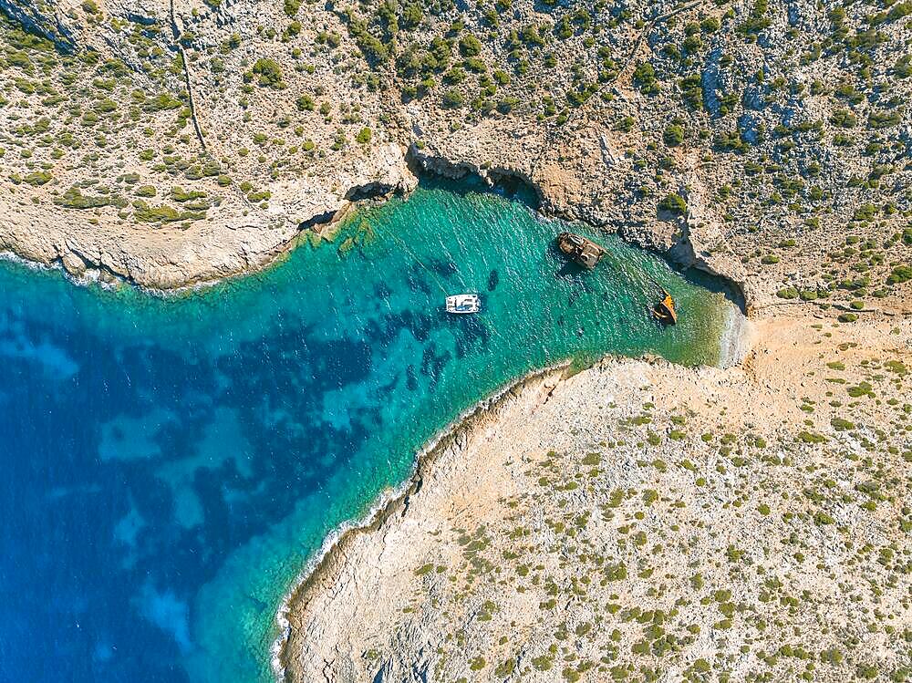 Aerial view, sailing catamaran in a bay, shipwreck Olympia, Amorgos, Cyclades Island, Aegean Sea, Greece, Europe