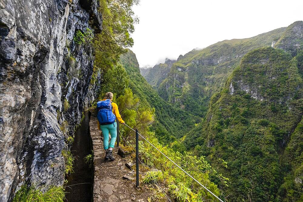 Hiker on a Levada, PR9 Levada do Caldeirao Verde, Madeira, Portugal, Europe