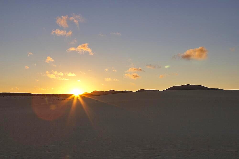 Evening light, dusk, sunset, backlight, dunes, hills, grey-white clouds, blue sky, northeast coast, dune area, El Jable, nature reserve, Fuerteventura, Canary Islands, Spain, Europe