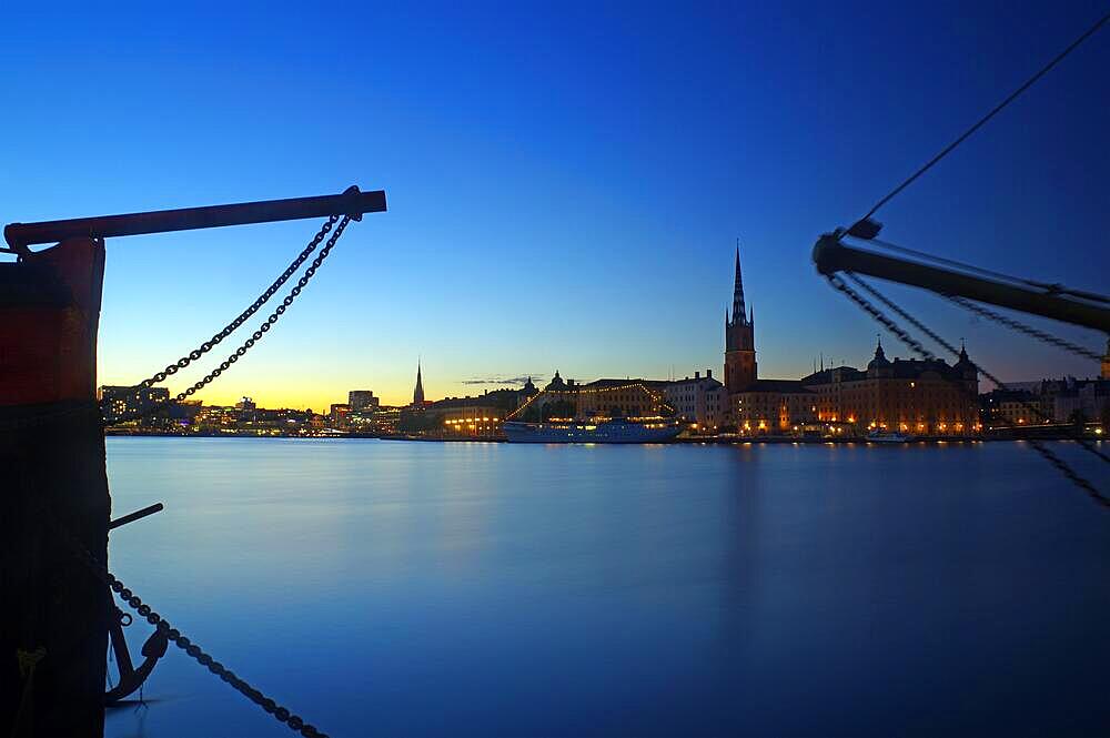 Illuminated harbour front at blue hour, Gamla Stan, passenger ship, dusk, Gamla Stan, Stockholm, Sweden, Europe