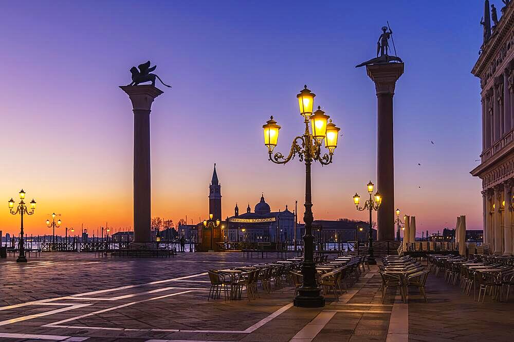 Early morning at Piazzetta San Marco, Colonne di San Marco and Colonna di San Todaro, in the background Basilica di San Giorgio Maggiore, Venice, Italy, Europe