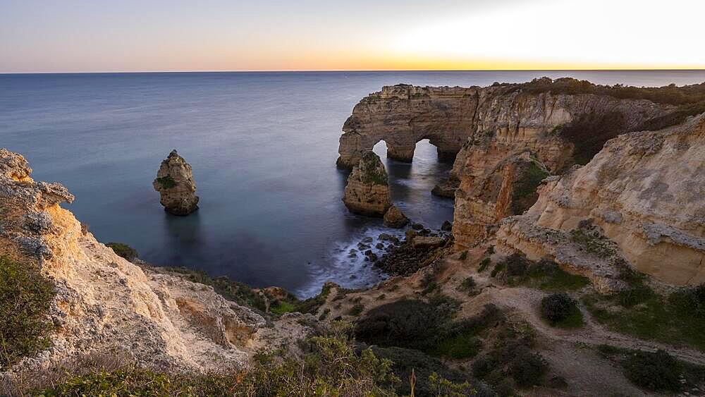 Sunset at Praia da Marinha, rocks and cliffs, steep coast in the Algarve, Portugal, Europe