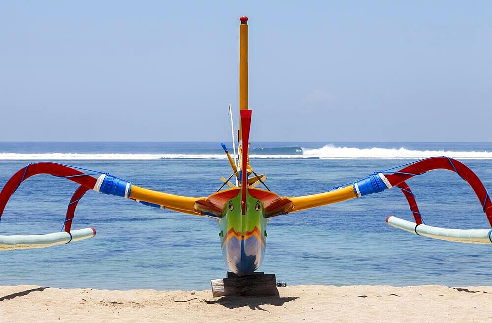 Brightly painted fishing outriggers on the beach at Sanur, Bali, IndonesiaIndonesia, Bali, Sanur, fishing outriggers on the beach of Sanur