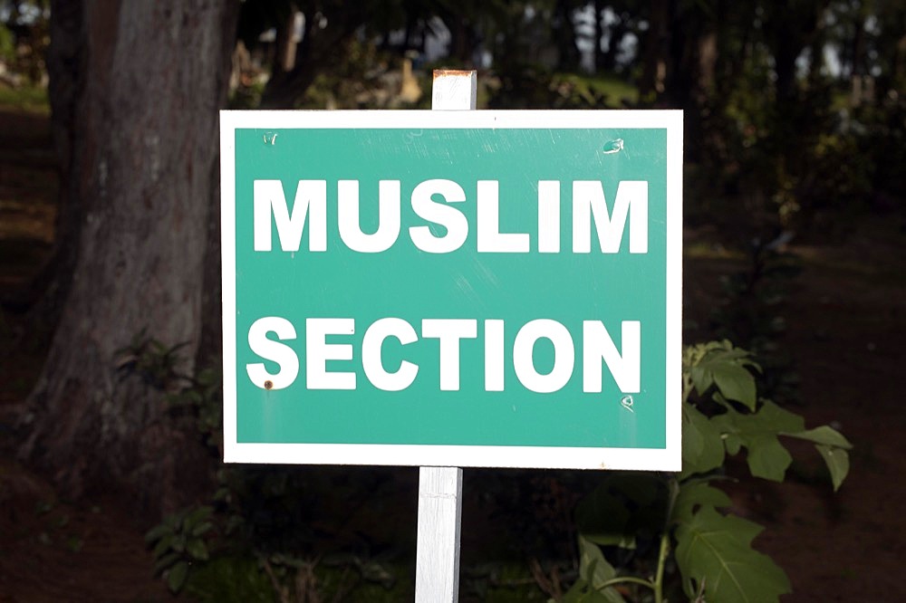 Sign reading Muslim Section in the cemetery of Trou dEau Douce, East Coast, Mauritius, Africa