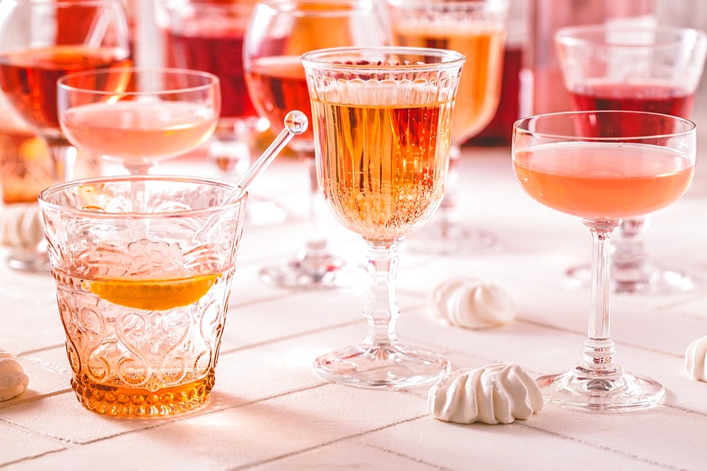 Assortment of rose wine, champagne, cocktails with bottles