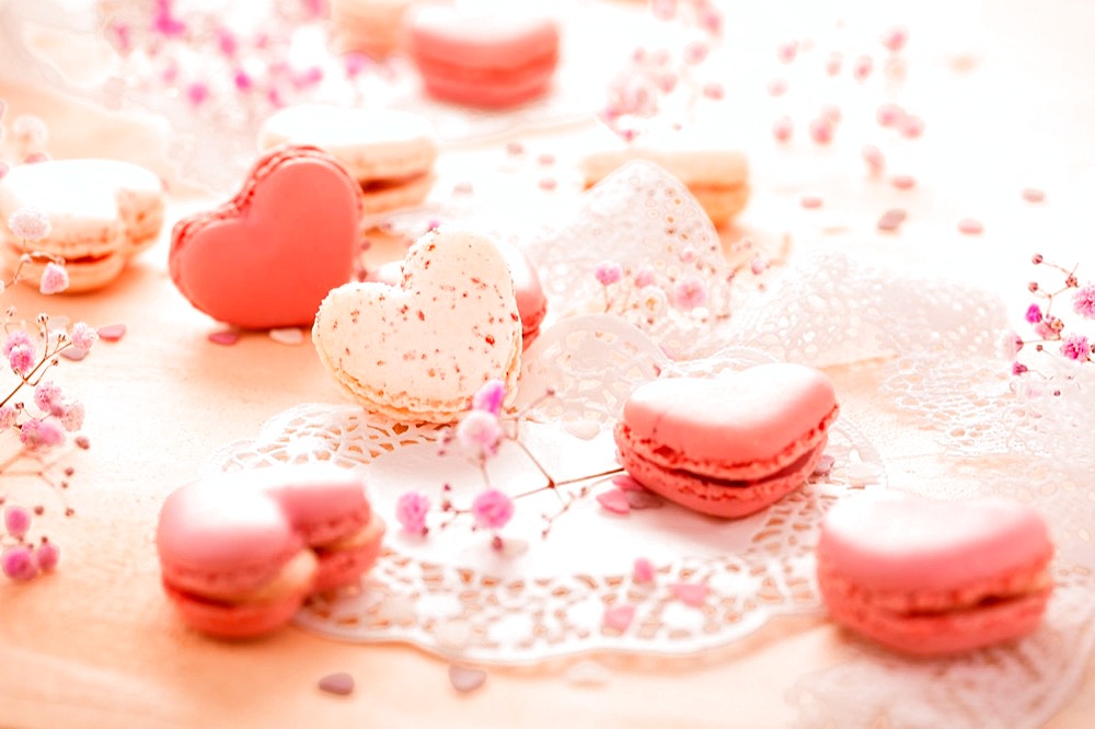 Happy Mothers Day - sweet macarons in heart shape with flowers in pink tone