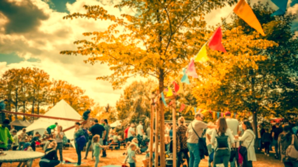 Abstract blur image of people and food trucks in vintage style. Blur image of street festival with bokeh for background usage