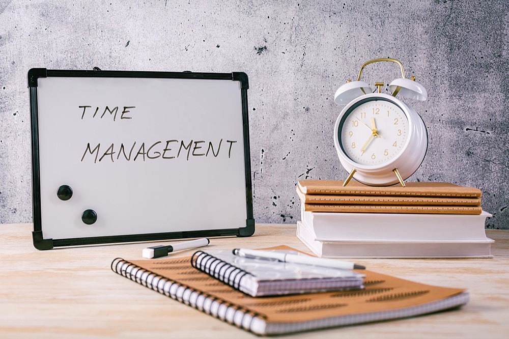 Concept of time management for office and school. Books, notepads with stickers