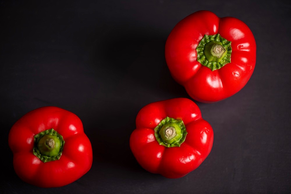 Red peppers on slate, fitness, cooking, vegetarian, vegan, vitamins, growing, healthy, close up, three, kitchen