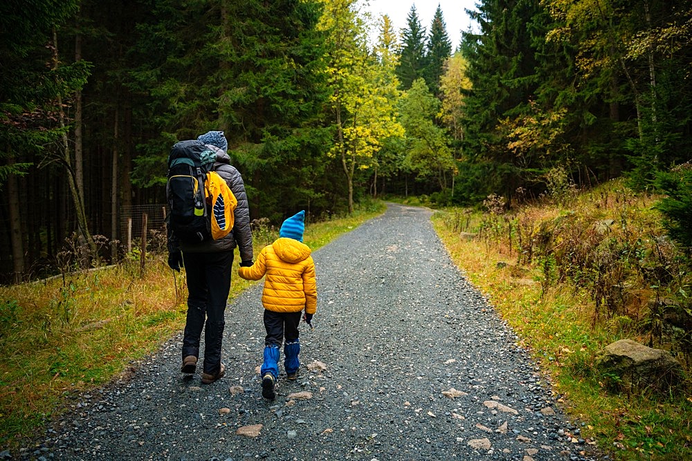 During the autumn, my mother and her little son go on a mountain trail. Polish mountains, Poland, Europe