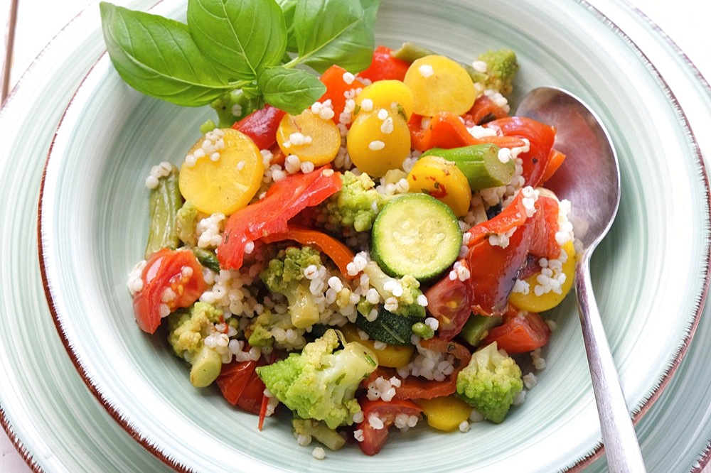 Vegetable salad with barley barley, arranged on a plate