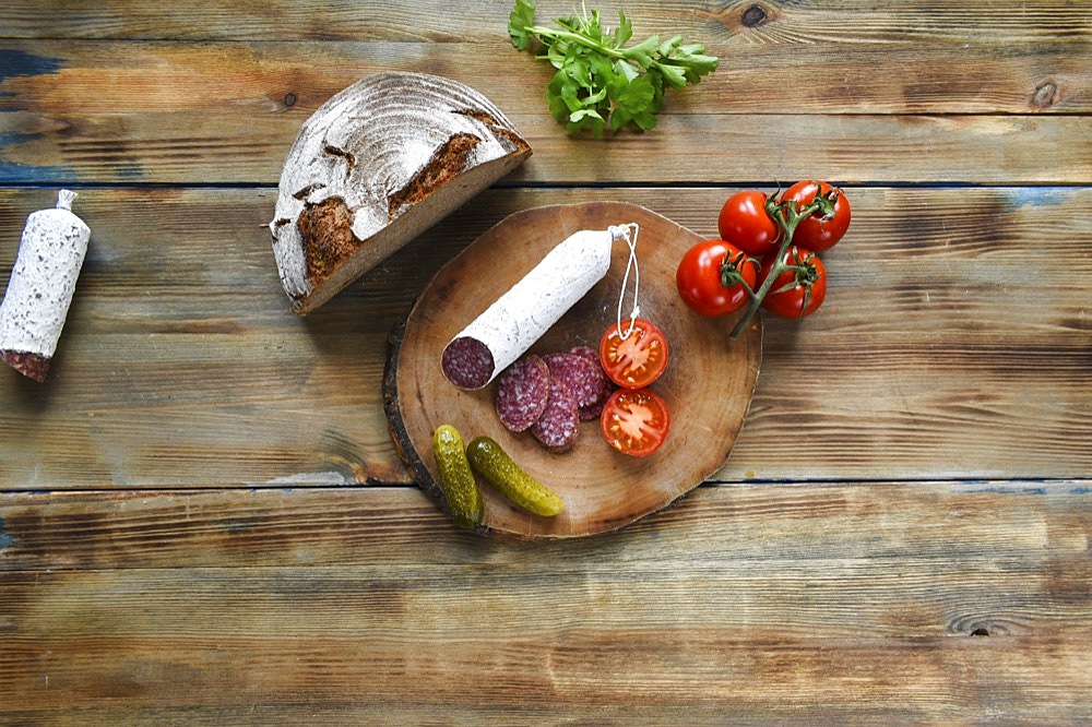 Snack with salami, cucumber and tomato