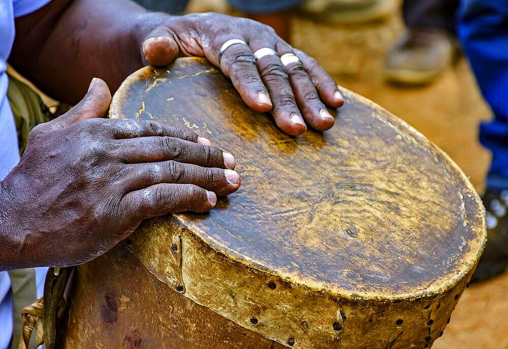 Percussionist playing a rudimentary atabaque during afro-brazilian cultural manifestation, Rio de Janeiro, Rio de Janeiro, Brasil