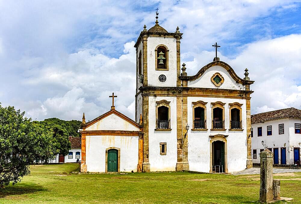 Old historic church surrounded by colonial houses in the famous and bucolic city of Paraty on the coast of Rio de Janeiro, Brasil