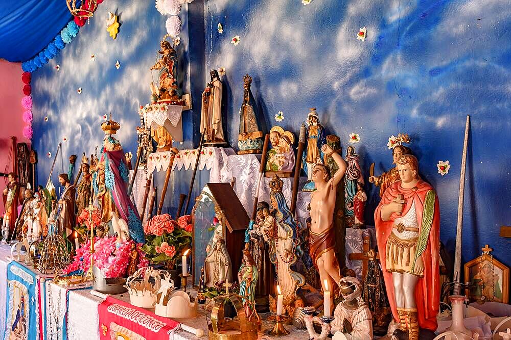 Brazilian religious altar mixing elements of umbanda, candomble and catholicism in the syncretism present in the local culture and religion, Comunidade dos Anturos, Contagem, Minas Gerais, Brasil