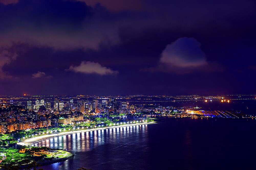 Guanabara Bay, airport and city of Rio de Janeiro seen from above at night, Brasil