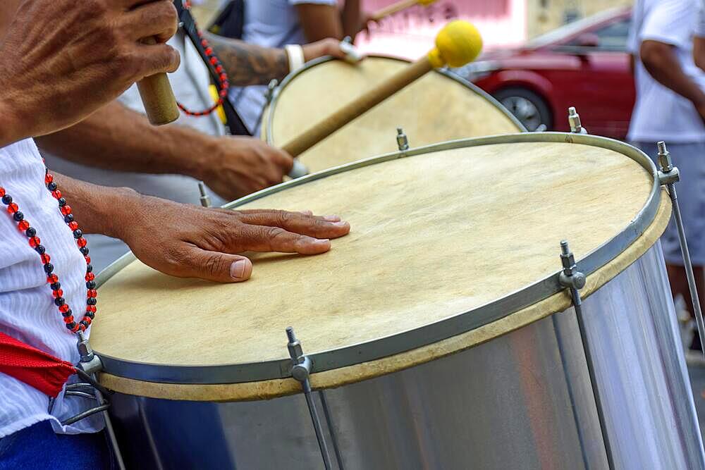 Drummer playing his instrument during carnival celebrations in the streets of Brazil, Brasil