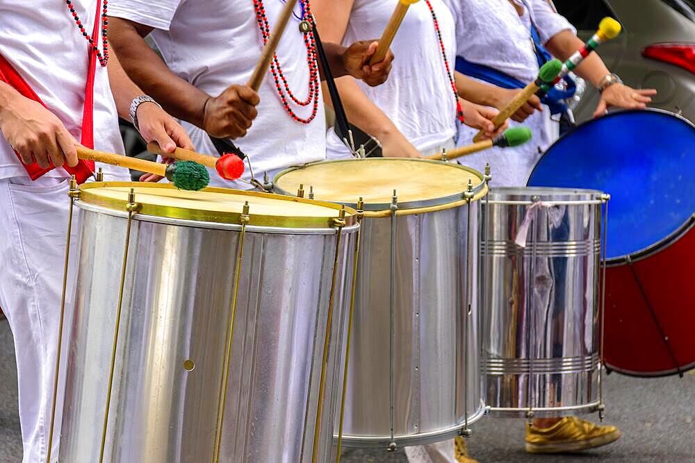 Several drummers with their musical instruments in the Carnival celebrations in the streets of Brazil, Brasil