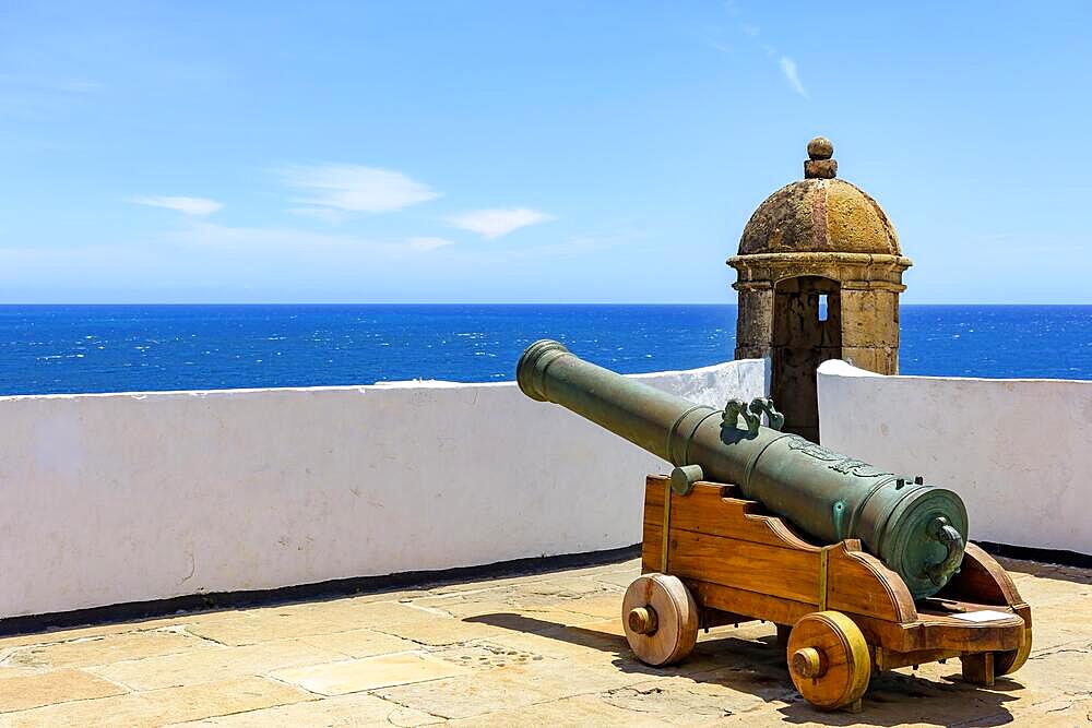 Old historic fort and colonial guardhouse with cannon pointed to the sea in the city of Salvador in Bahia, Brasil