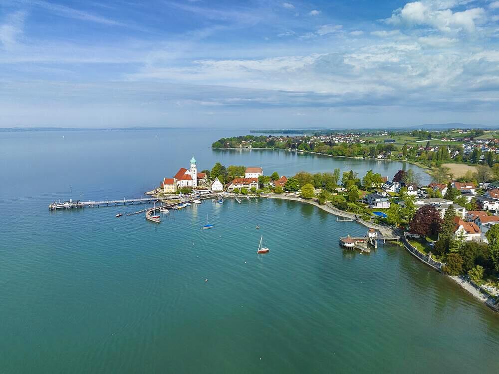 Aerial view of the moated castle peninsula on Lake Constance with the baroque church of St. George, jetty and marina, with the village of Nonnenhorn in the background Lindau district, Swabia, Bavaria, Germany, Europe