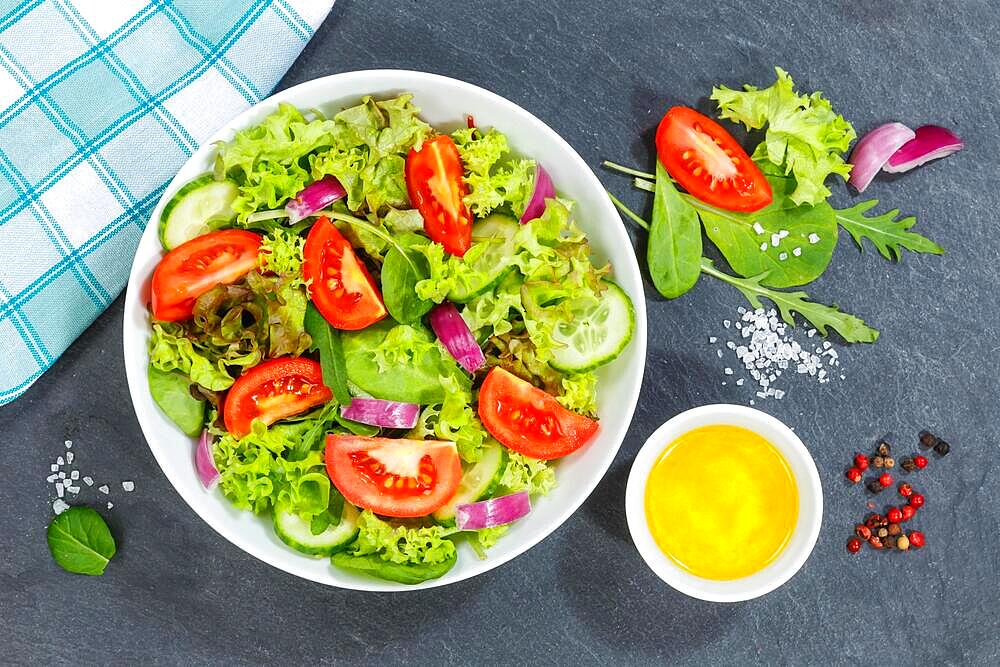 Mixed salad with fresh tomatoes healthy eating food from above on slate in Stuttgart, Germany, Europe