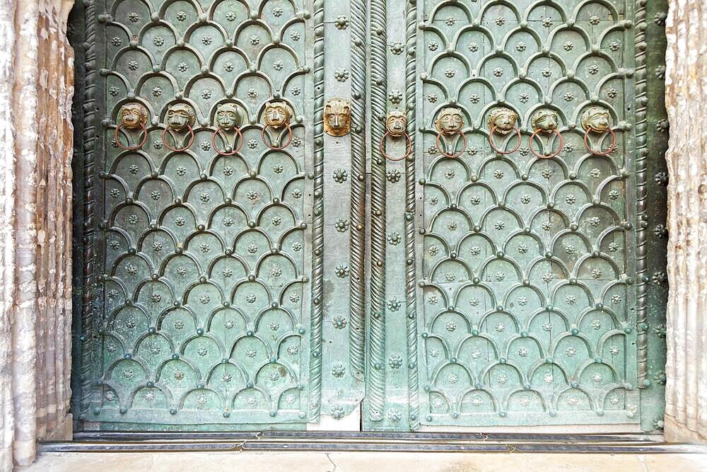 Bronze lion heads on the main portal of St Mark's Basilica, Venice, Italy, Europe