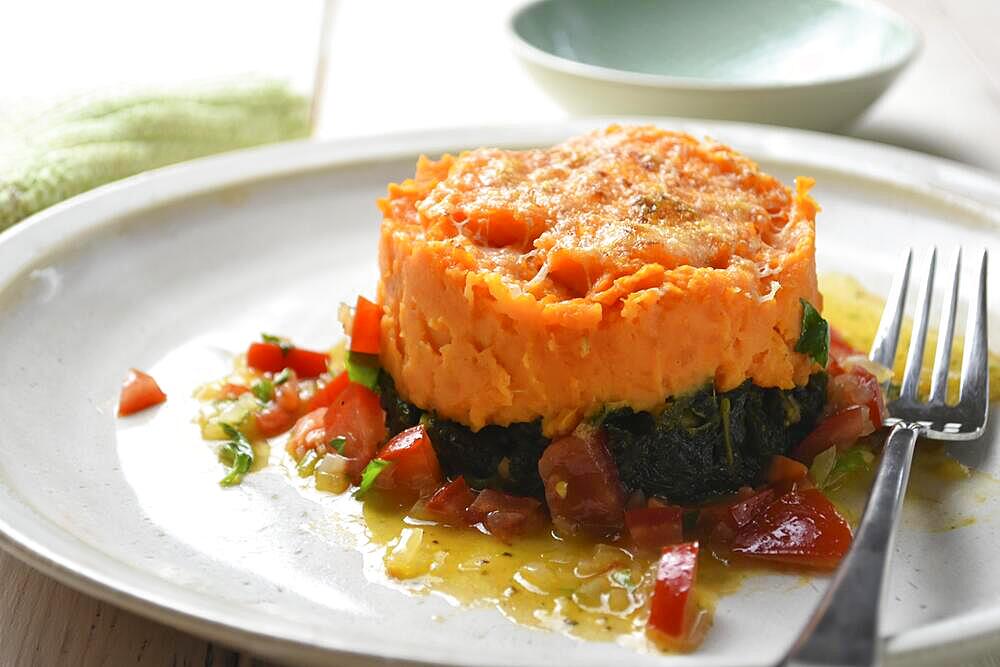 Sweet potatoes with kale served on a plate