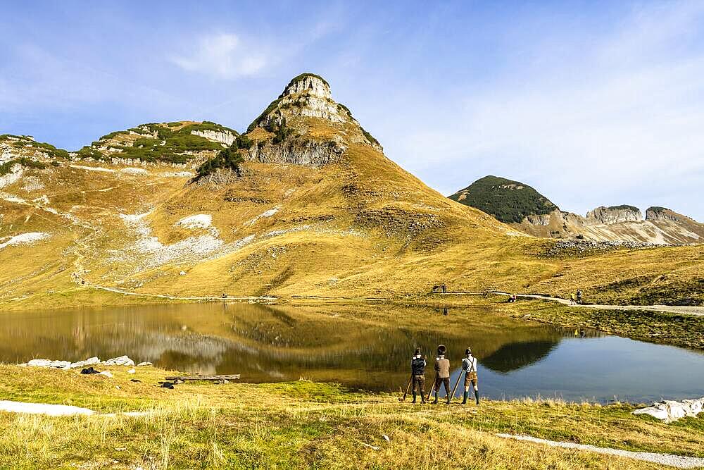 The Austrian alphorn trio Klangholz plays the alphorn at the Augstsee on Mount Loser, Ausseerland, Salzkammergut, Austria, Europe