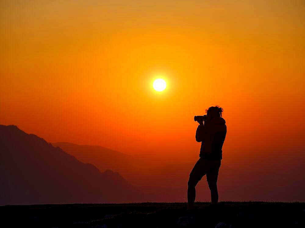 Silhouette of a photographer at sunset, Trattberg, Bad Vigaun, Land Salzburg, Austria, Europe