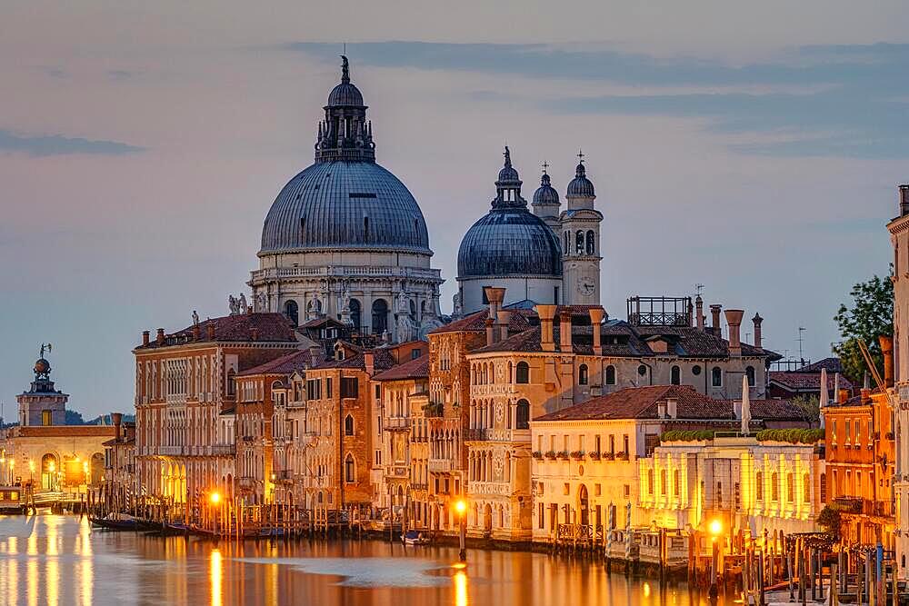 The Basilica Di Santa Maria Della Salute and the Grand Canal in Venice in front of sunrise