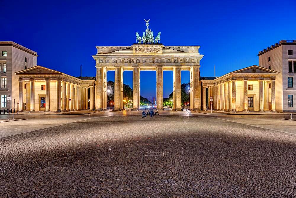 The famous illuminated Brandenburg Gate in Berlin at night and without people