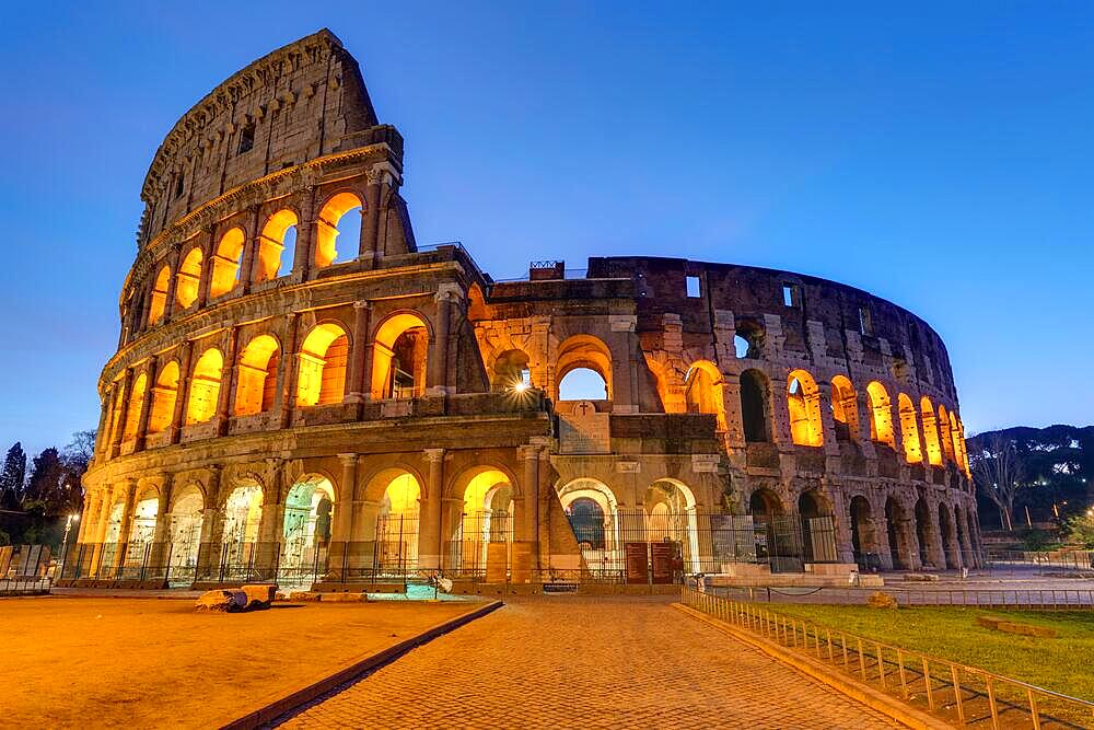 The famous Colosseum in Rome illuminated at dusk