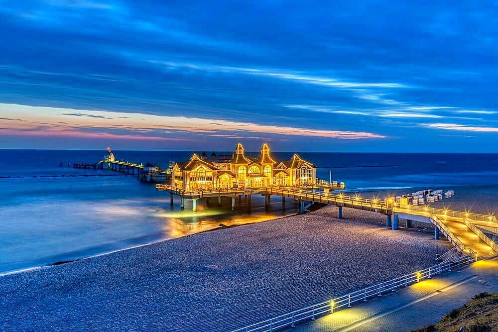 Beach and pier in Sellin on the island of Ruegen in Germany in front of sunrise